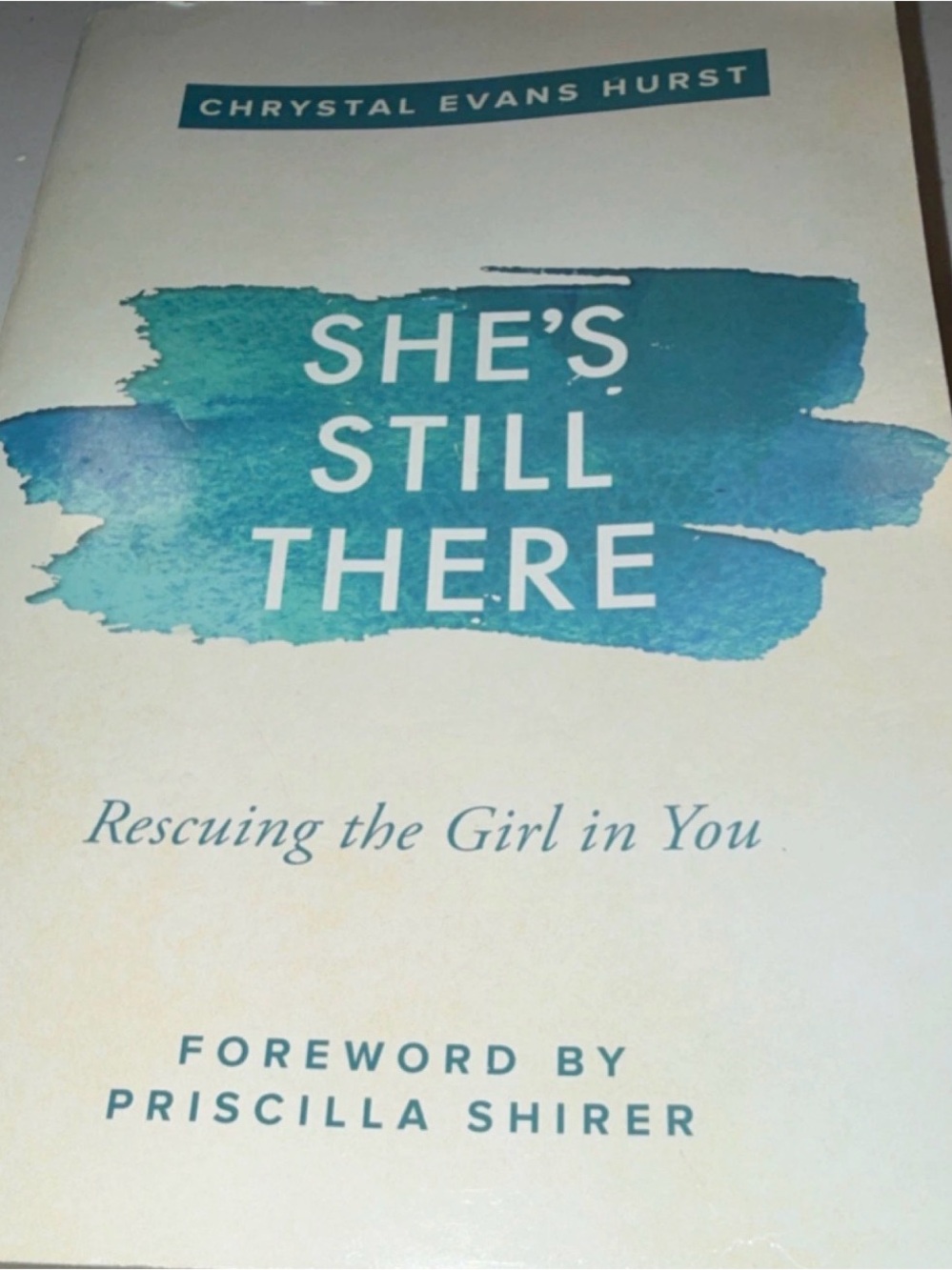 She's Still There by Chrystal Evans Hurst - Teal Accent Cover